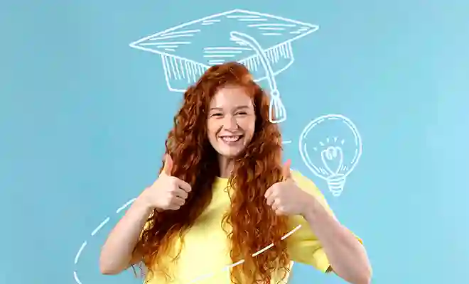 Young student smiling with graduation had and light bulb in the background