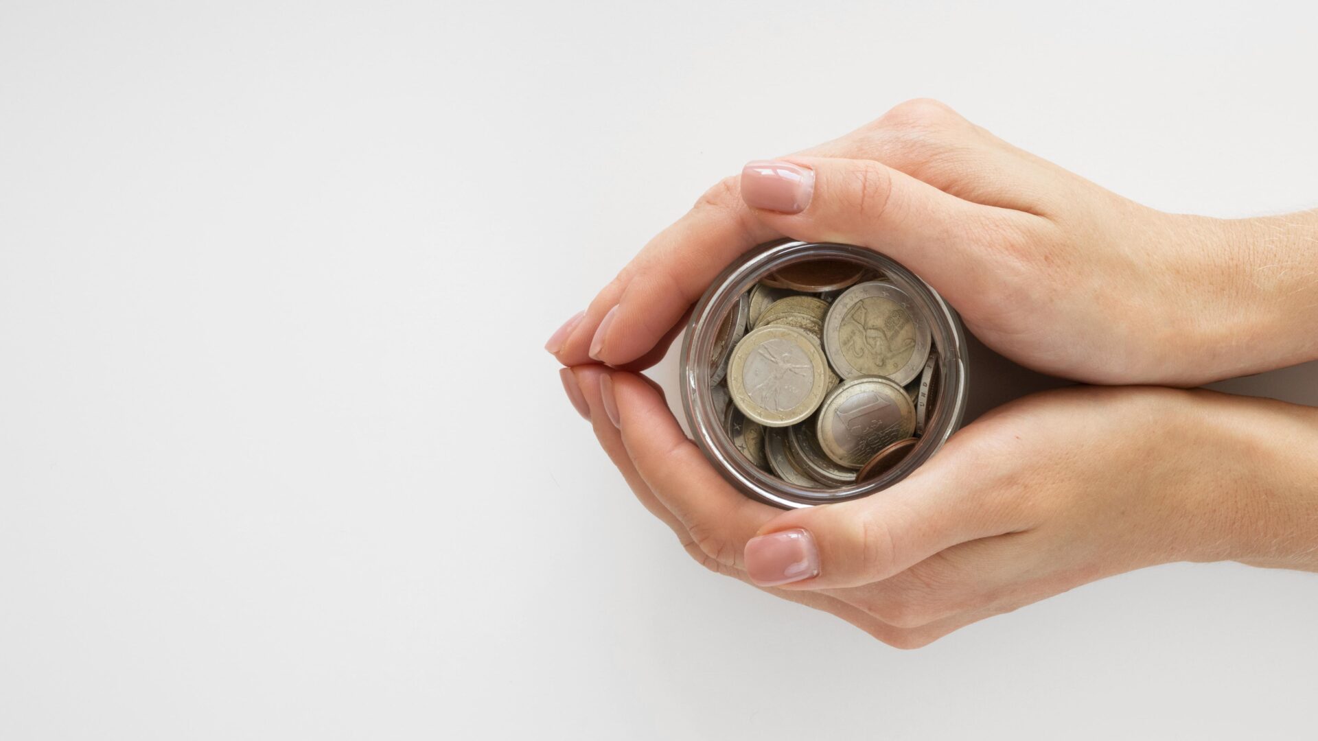 person-holding-jar-with-coins